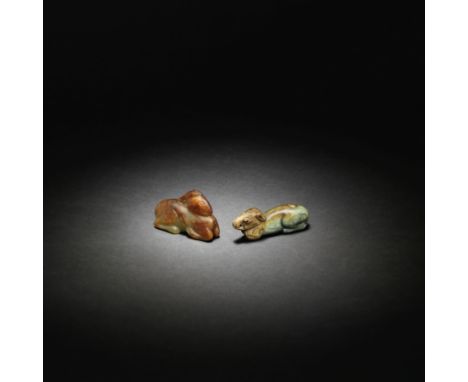 A PALE GREEN AND RUSSET JADE CARVING OF A DEER AND A JADE CARVING OF A HOUNDSong/Yuan DynastyBoth smoothly carved recumbent w