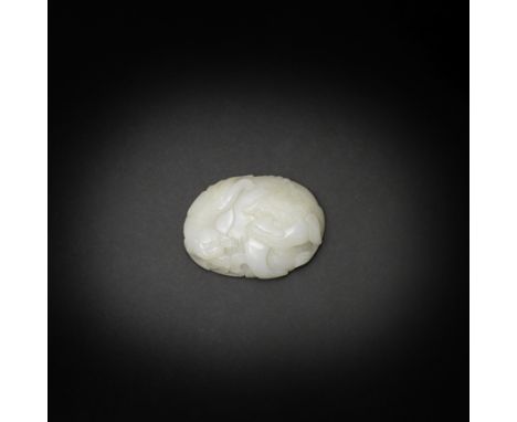 A WHITE JADE 'BUDDHIST LION AND CUB' BELT BUCKLEQianlongSkilfully carved as a coiled Buddhist lion turning its head, its larg