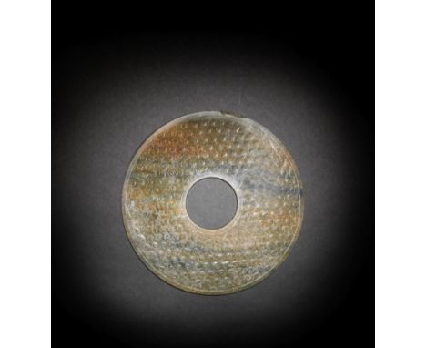 A LARGE CELADON AND RUSSET JADE DISC, BIEastern Zhou Dynasty/Han DynastyThe large circular disc meticulously and crisply carv