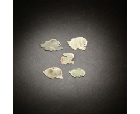 FIVE JADE 'HARE' PLAQUESShang/early Western Zhou DynastyEach finely carved in the shape of a recumbent rabbit with a circular