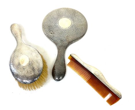 Hallmarked silver vanity set to include mirror, brush and comb (Slight damage as seen in image to teeth of comb), overall tot