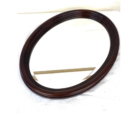 Mahogany framed oval mirror measures approx 23" tall 17" wide 