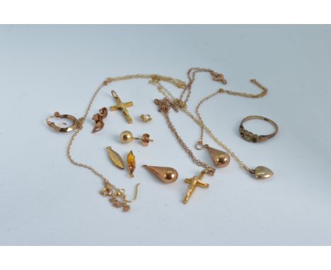 A mixed lot of 9ct gold and yellow metal jewellery, including a ring (AF) stamped 9ct, hallmarked crucifixes, earrings, chain