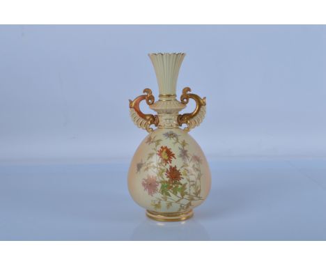 A Royal Worcester blush ivory twin handled bottle vase, shape no. 1327. 28cm tall.