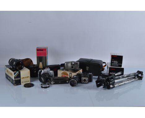 A good collection of assorted cameras, lenses and related equipment, including a Soligor tele-auto 1:5.5 f=300mm lens, Canon 