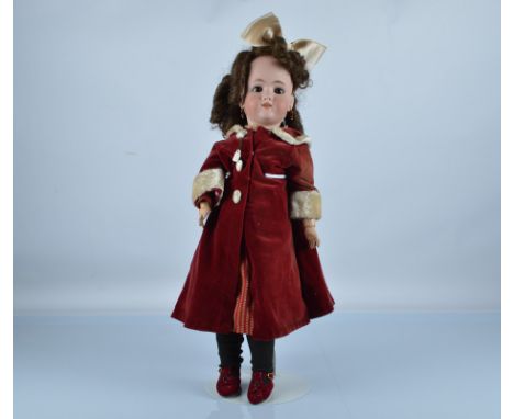 A Simon and Halbig for Heinrich Handwerck child doll, with brown sleeping eyes, pierced ears, replaced brown wig with ringlet