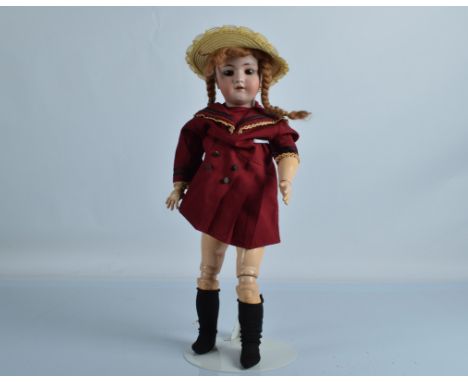 A Simon and Halbig for Heinrich Handwerck child doll, with brown sleeping eyes, pierced ears, replaced red wool wig, jointed 