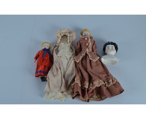 A china shoulder head Helen doll, head turned slightly to the right, Helen embossed on moulded blouse, 5 inch (12.5cm), head 