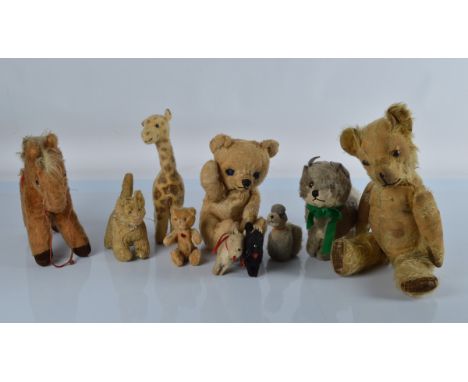 Various vintage teddy bears and soft toys, a seated Chiltern with waving mechanism, 8 3/4 inch (22cm) high, a French J.P Mass