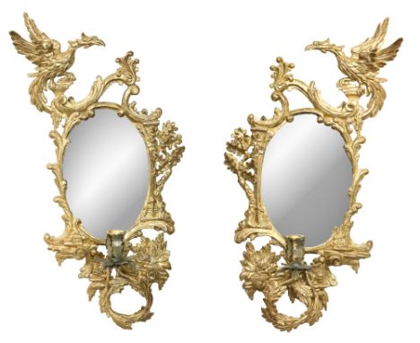 A pair of attractive giltwood Wall Mirrors, in the manner of Thomas Chippendale, each decorated with opposing surmounted Ho H