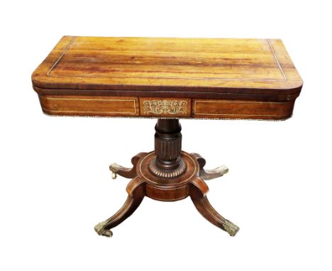 A Regency rosewood brass inlaid fold-over Card Table,&nbsp;the top with single strap inlay above a frieze with central decora