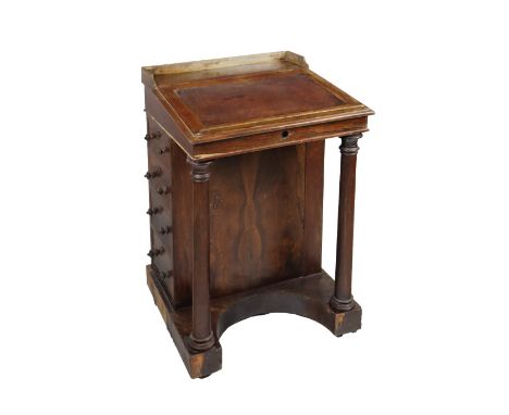 A 19th Century rosewood Davenport, the gallery top above a leather inset slope front with fitted interior supported by front 