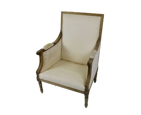A 19th Century French Fauteuil, covered in cream fabric with front scrolled arms on front tapering reeded legs. (1)