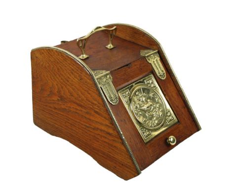 A collection of Edwardian brass Fire Furniture, comprising pairs of Andirons, Fire Tongs, Poker and an oak Coal Scuttle, with