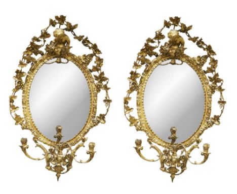 A pair of fine quality Victorian period Girandoles, each with Bacchus cherub surmounted, surrounded by vine leaves and grapes