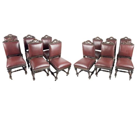 A fine quality set of 12 Victorian carved oak Dining Chairs, each with carved carrying capital depicting floral garland, abov