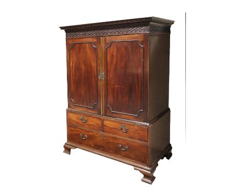 A fine quality 19th Century mahogany Linen Press, in the manner of Thomas Chippendale, the cornice with dentil moulding above