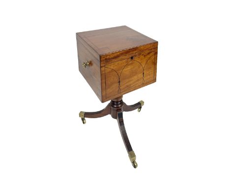 A fine quality Irish mahogany Regency Cellaret, possibly Cork, the lift top with fitted interior and ebony strung inlay above