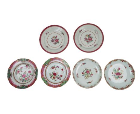 A pair of Chinese 18th Century Qianlong Fencai Dinner Plates, decorated in the typical taste with flowers and trestle border,