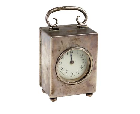 A miniature silver cased Carriage Clock, by Goldsmiths &amp; Silversmiths Co., 7cms high (2 3/4"). (1)
