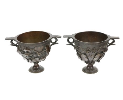 After the Antique  A pair of attractive bronze Roman inspired twin handled cup "Skyphos" modelled with ivy leaves and pods, e