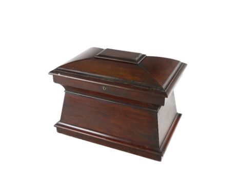 A fine quality Irish mahogany William IV period sarcophagus shaped Cellaret, the hinged top opening to reveal a fitted interi
