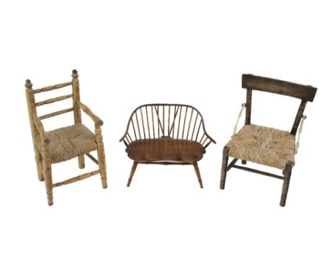 A Sugan miniature or Apprentice Armchair, with ladder back, turned arms, legs and stretchers, together with an assimilated ba