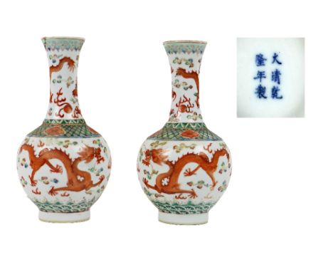 A pair of 19th Century Chinese tubular porcelain Dragon Vases, with opposing dragons on top and main section with colourful m