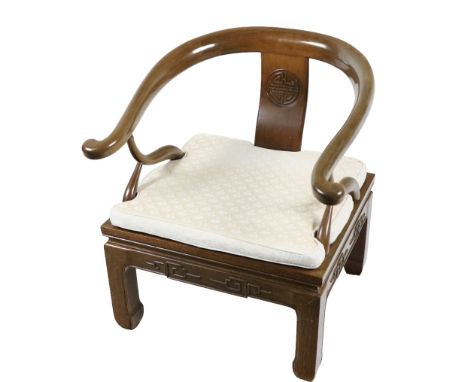 A 20th Century Chinese horse shoe shaped hardwood Armchair&nbsp; with scroll arms upholstered loose cushioned seat above a de