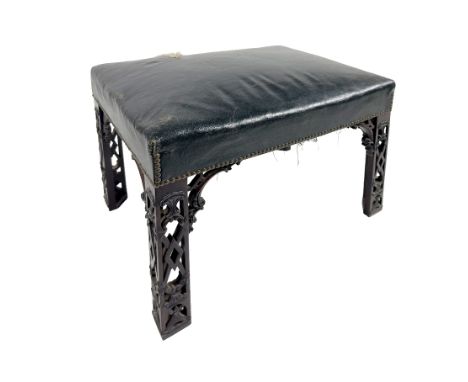 A 19th Century Irish mahogany Footstool,&nbsp;in the manner of Thomas Chippendale, the seat covered in green hide with brass 