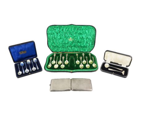 A cased set of 12 decorative figural silver gilt Teaspoons, and matching Tongs by Asprey of London, retailed by Manoah Rhodes