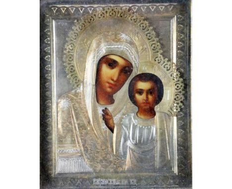 A late 19th Century / early 20th Century Russian Icon,&nbsp;(St. Petersburg) with ornate silver and gilt pierced and etched m