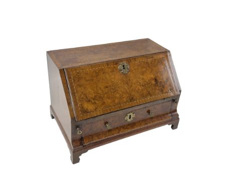 A fine quality 19th Century 'Apprentice' walnut Bureau Commode, the rectangular top with herringbone crossbanding, above a co