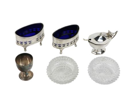 An attractive pair of English silver Georgian style oval Salts, with blue glass liners, and etched and pierced decoration, ha