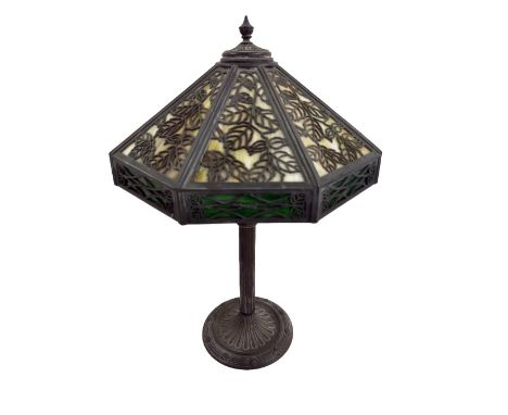 An attractive heavy brass "Tiffany" style extending Table Lamp, with pierced and stained glass shade of octagonal domed shape