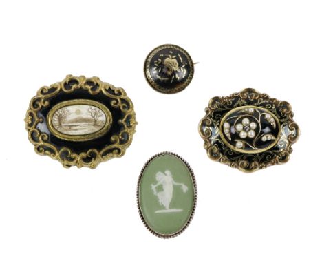 A fine quality Victorian gold and enamel Mourning Brooch, with raised oval center decorated with pearls and single diamond of