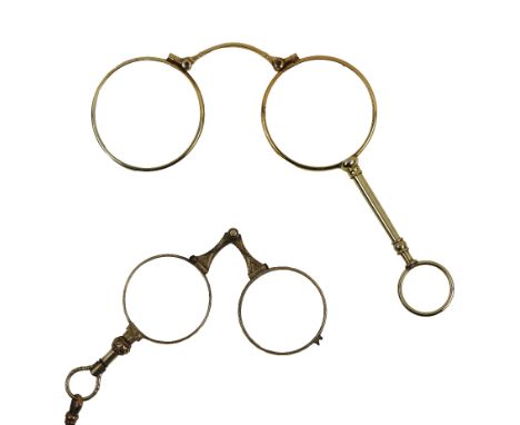An attractive etched design gilded Lorgnette or Opera Glasses, with chain; together with another Lorgnette with rigid finger 