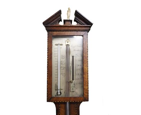 A Georgian period Scottish mahogany cased Stick Barometer, the arched pediment with central finial above a silver dial by Poz