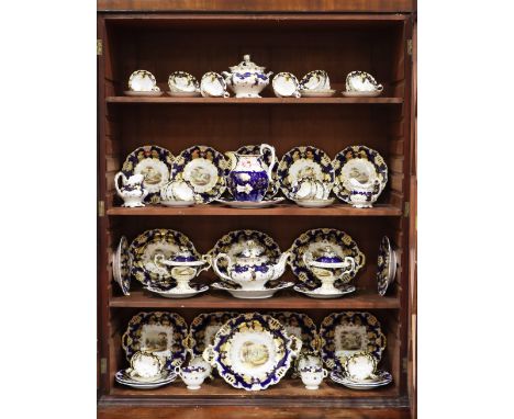 An important 19th Century British Scenery Davenport Royal blue and gilt highlighted porcelain Cabinet Service, comprising cup