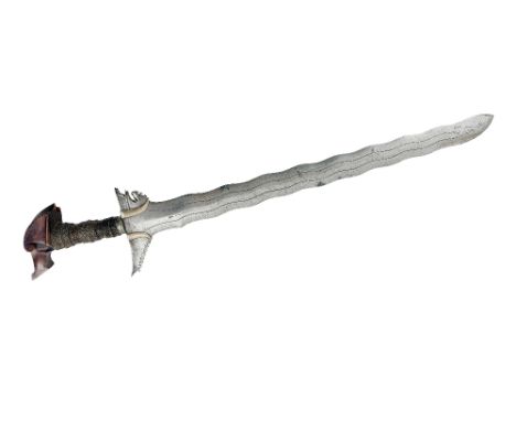 A 19th Century Moro Kris, early 1800's, the shaped&nbsp; wooden handle with wire strap handle and pierced shaped hilt, issuin