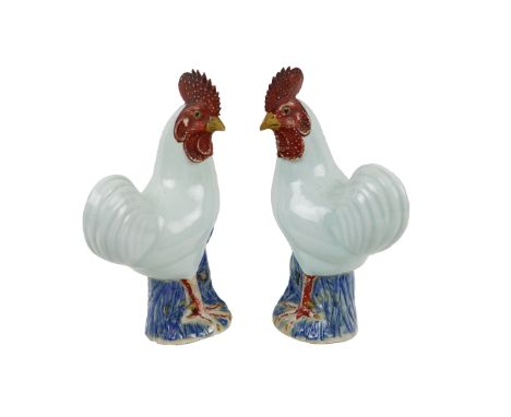 A pair of 19th Century Chinese Export Cockerels, each of white glazed body and iron red bumpy comb and wattle, standing on a 