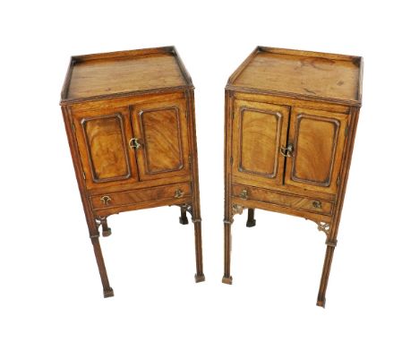 An important pair of George III mahogany Lockers, in the manner of Thomas Chippendale, each with moulded gallery above two pa