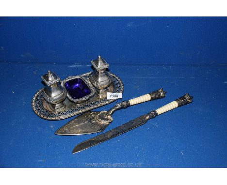 A plated cake knife and fork with crowns to the top, along with a silver plated condiment set. 