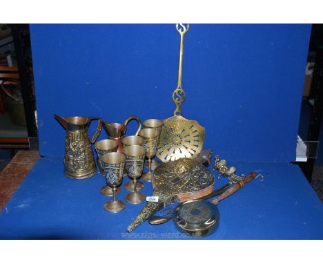 A pair of brass bellows, a cream skimmer, a toasting fork, a show horn, a chestnut roaster and six goblets.