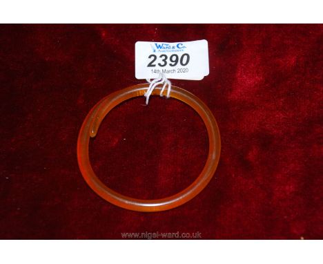 An amber composition bangle.