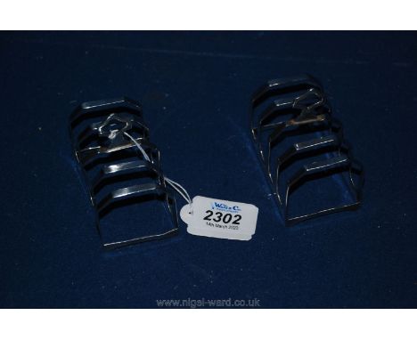 A pair of silver four division toast racks hallmarked Sheffield 1938, stamped EV for Emile Viner.