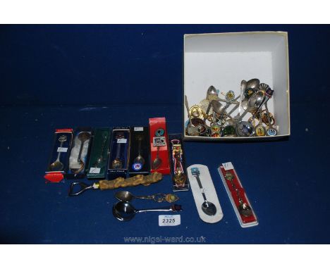 A quantity of button key rings and commemorative teaspoons, etc.