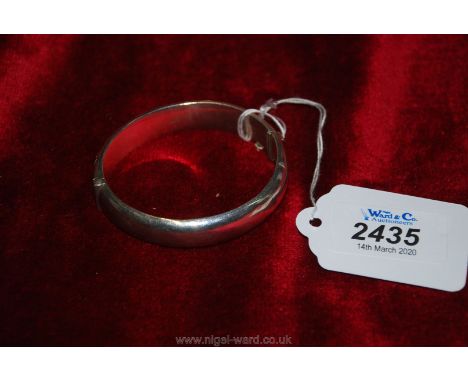 A silver Bangle with Birmingham hallmark,clasp a/f and safety chain missing.