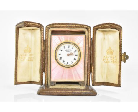 An early 20th century Asprey silver miniature travel clock, sponsor marks for Charles William Guignard, import marks for Lond