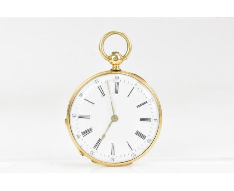 A late 19th century gold, open face fob watch, tests at 14ct-18ct, the white enamel dial having Roman numerals, engine turned